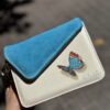 White-Blue-Corner-Clutch-Flap-Tassel-with-Blue-Butterfly-front